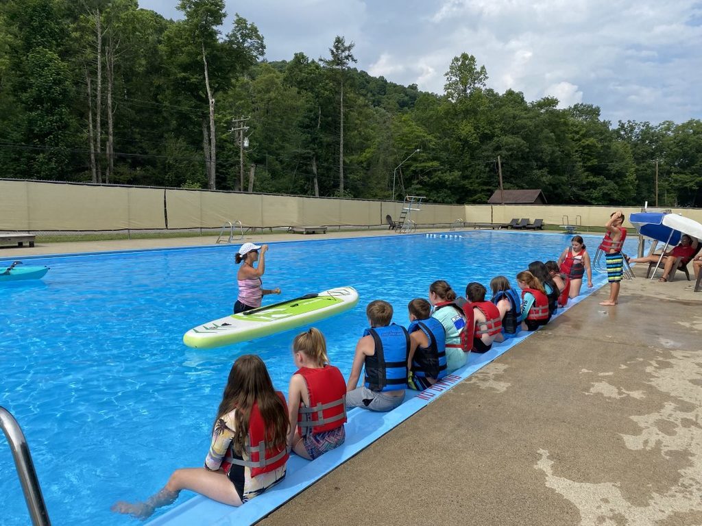 Paddleboard instruction at the pool