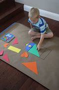 boy playing with tangrams